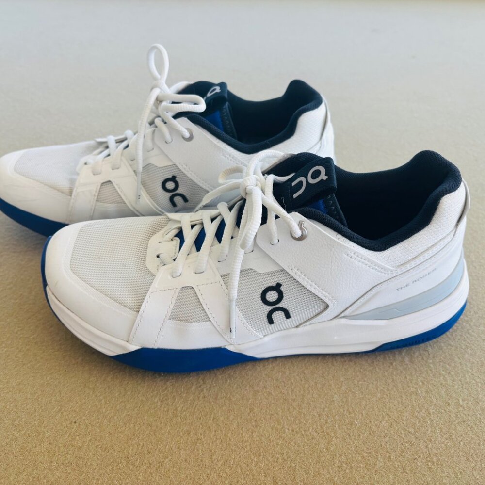 On Running White and Blue Athletic Shoes